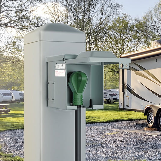 RVGUARD 50 amp RV outlet box powering an RV at a campground — reliable electricity for AC, fridge, and electronics on the road